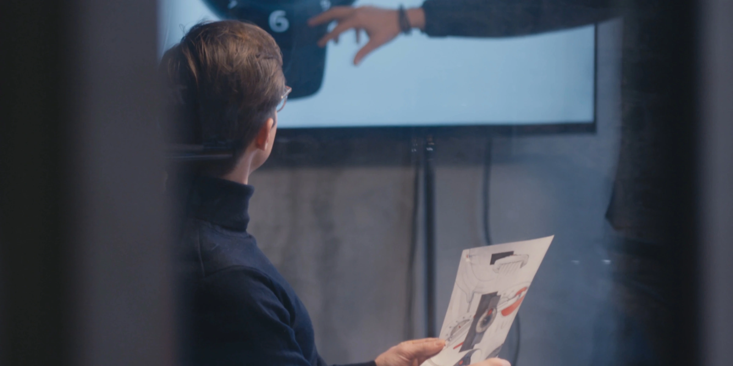 Designer reviewing sketches