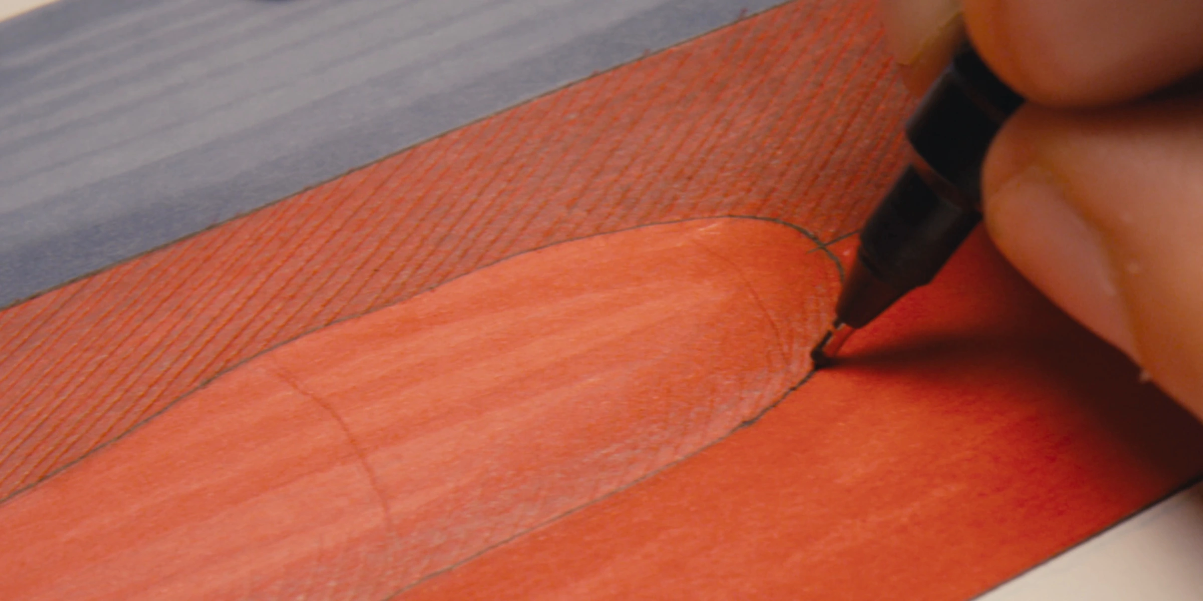 Drawing on an orange material sample