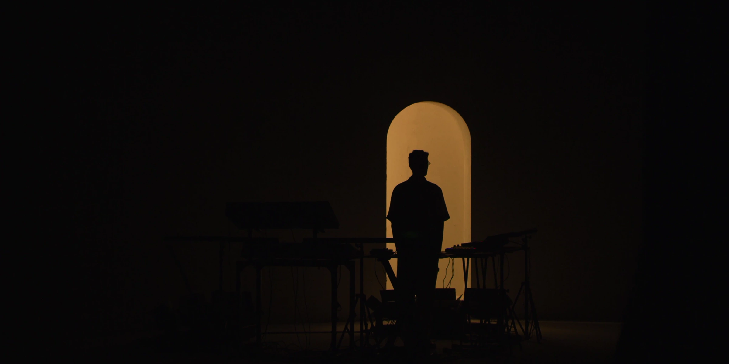 Silhouette in the illuminated golden arch