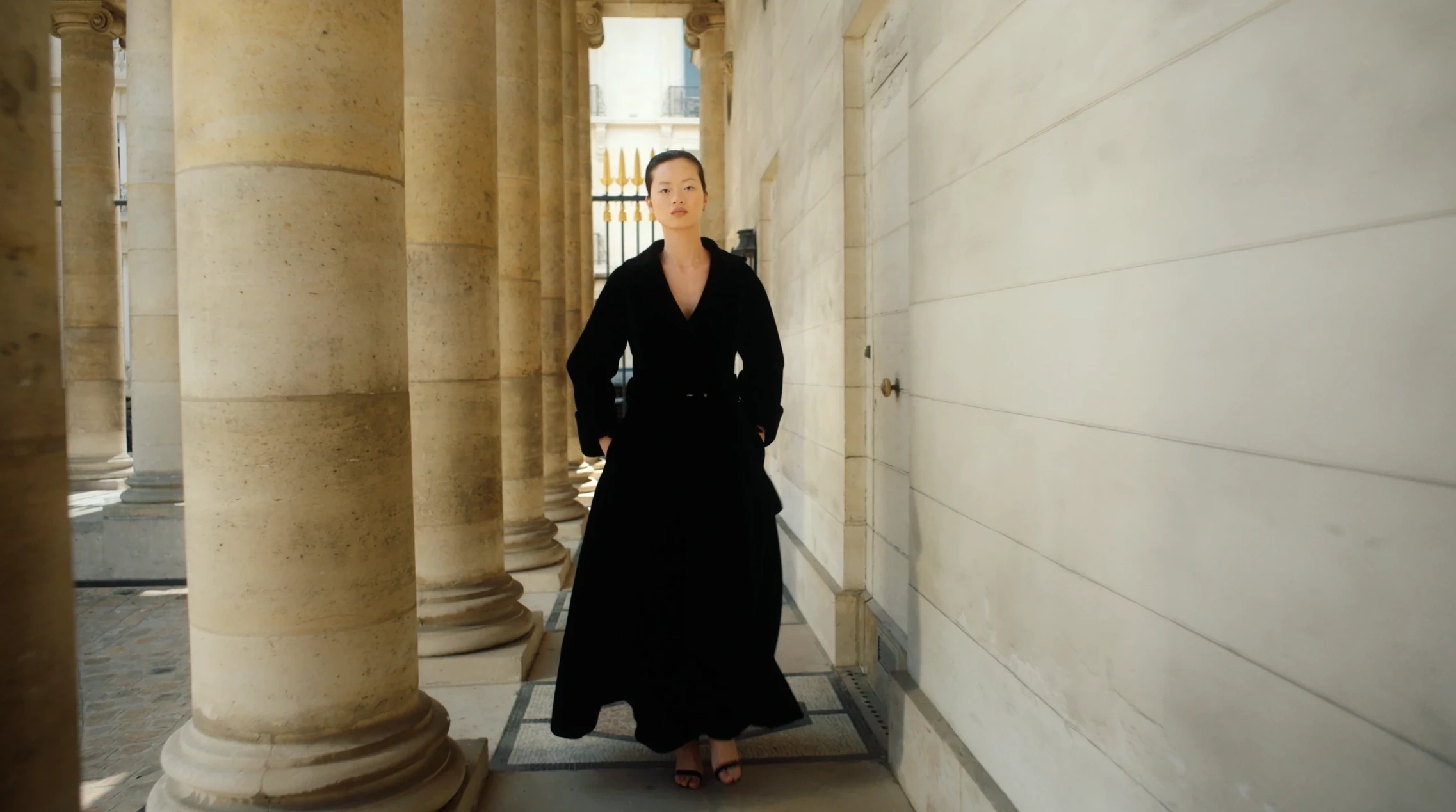 Black couture silhouette in the colonnade