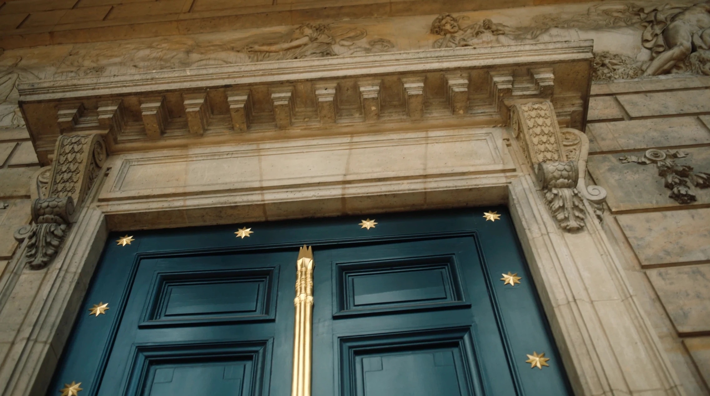 Architectural details above a blue door