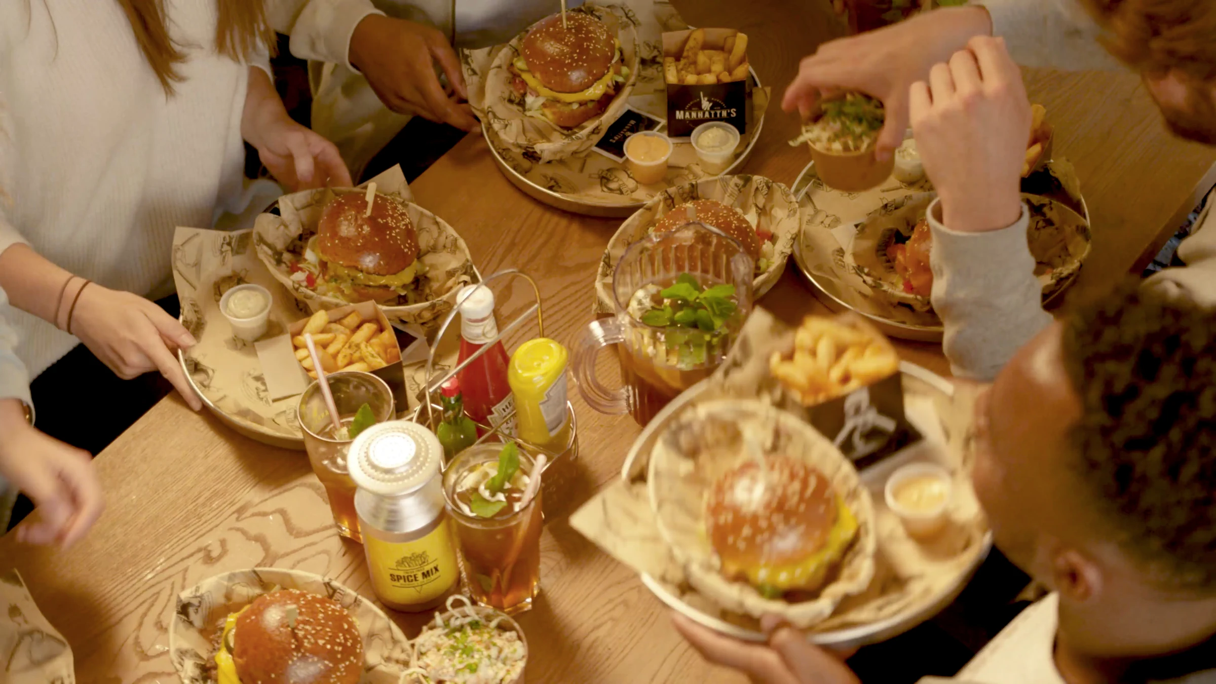 Burgers and drinks shared around a table