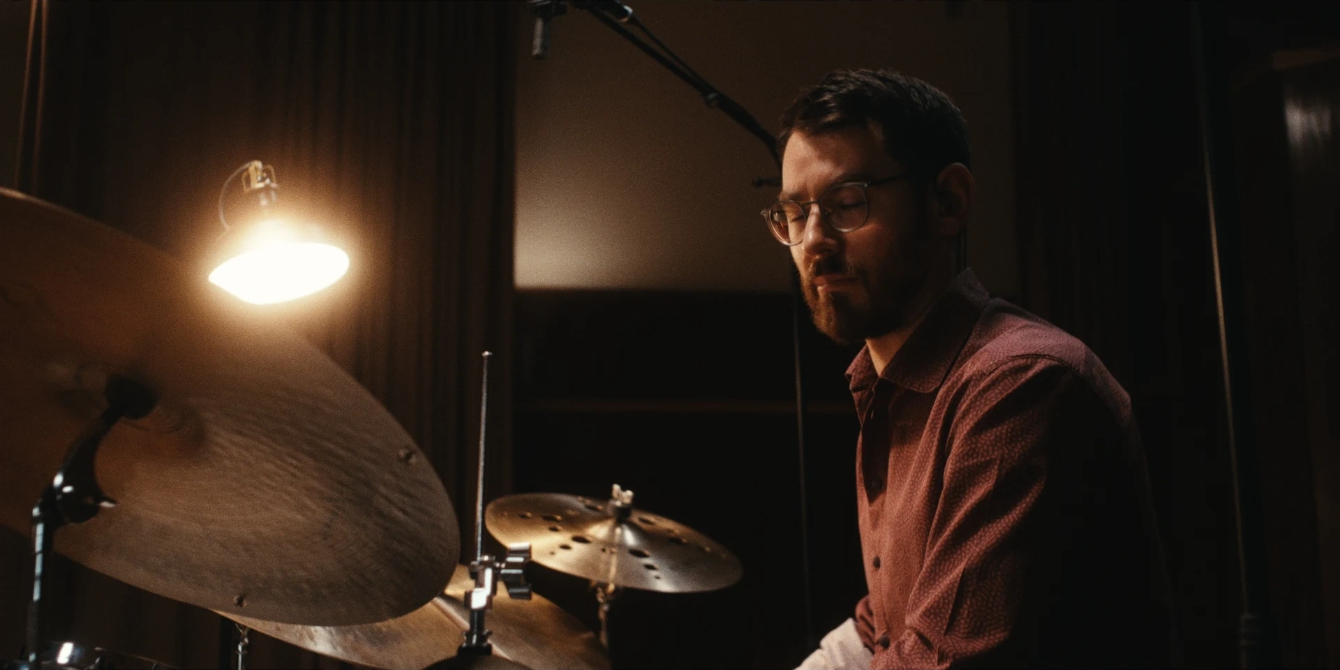 Drummer in warm studio light