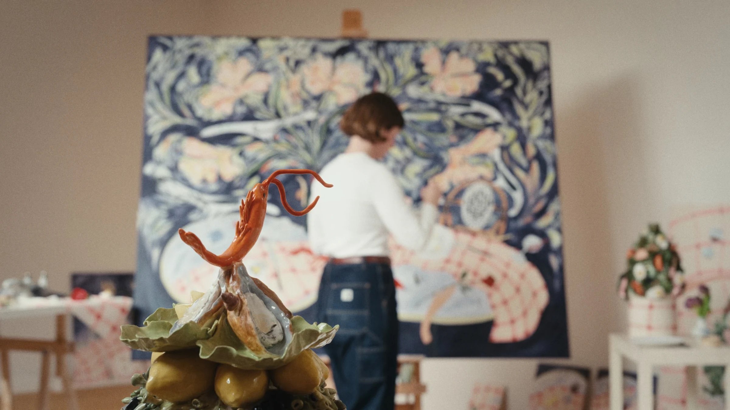 Ceramic sculpture with Philippine painting in the background