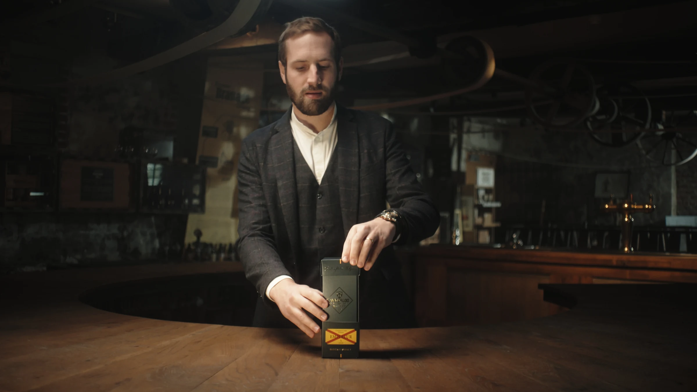 Unboxing Waterloo Whisky at the wooden bar