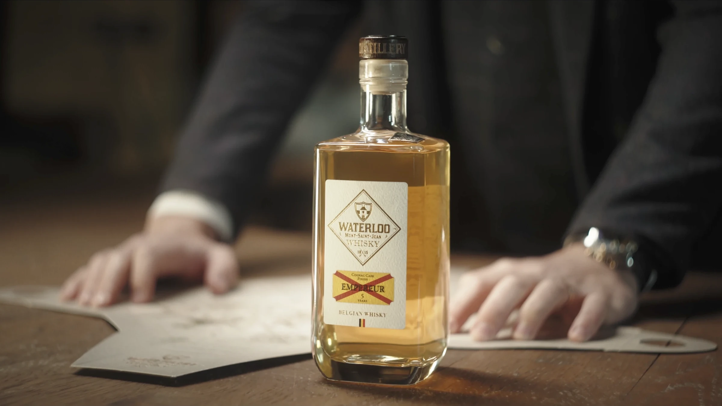 Empereur bottle with the unfolded Waterloo map