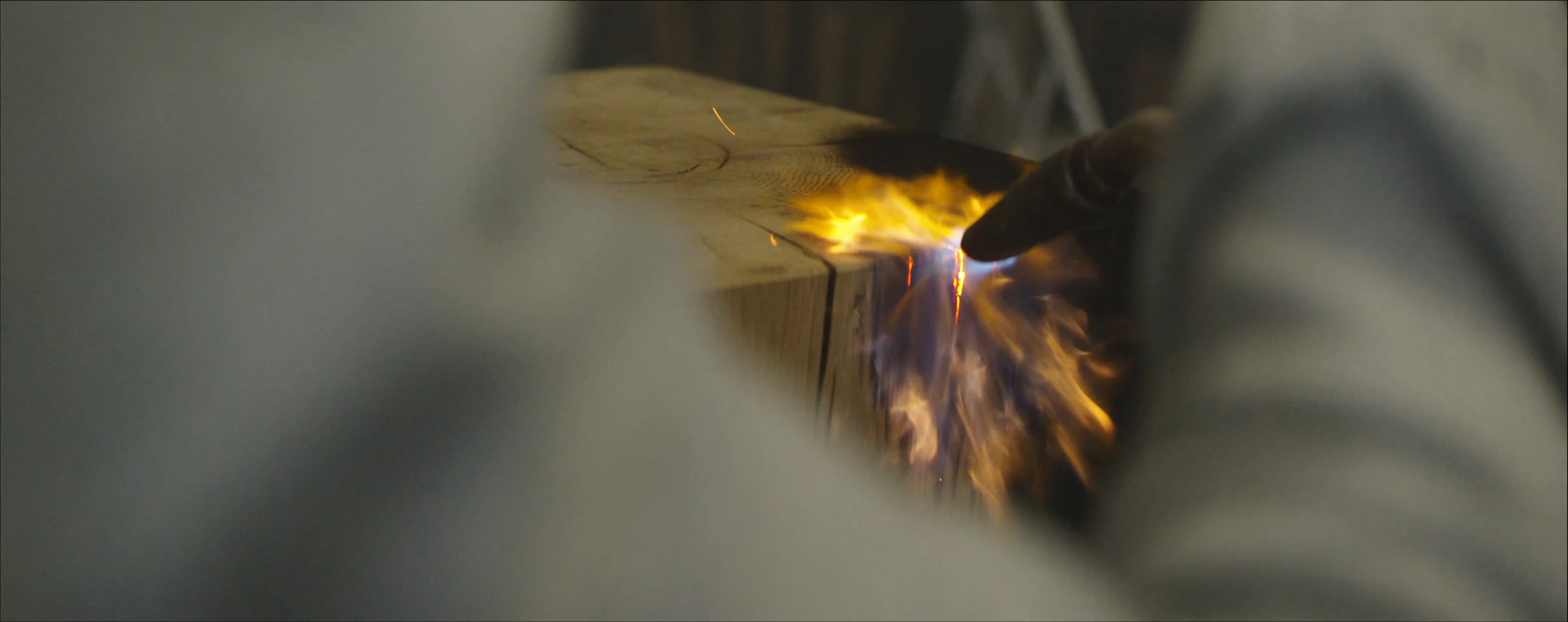 Wood being worked with a flame
