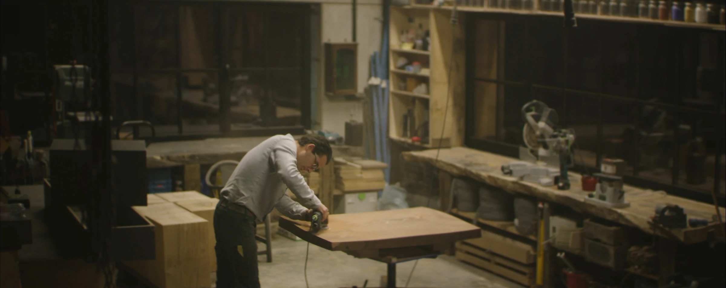 Wim Pues shaping a table in his workshop
